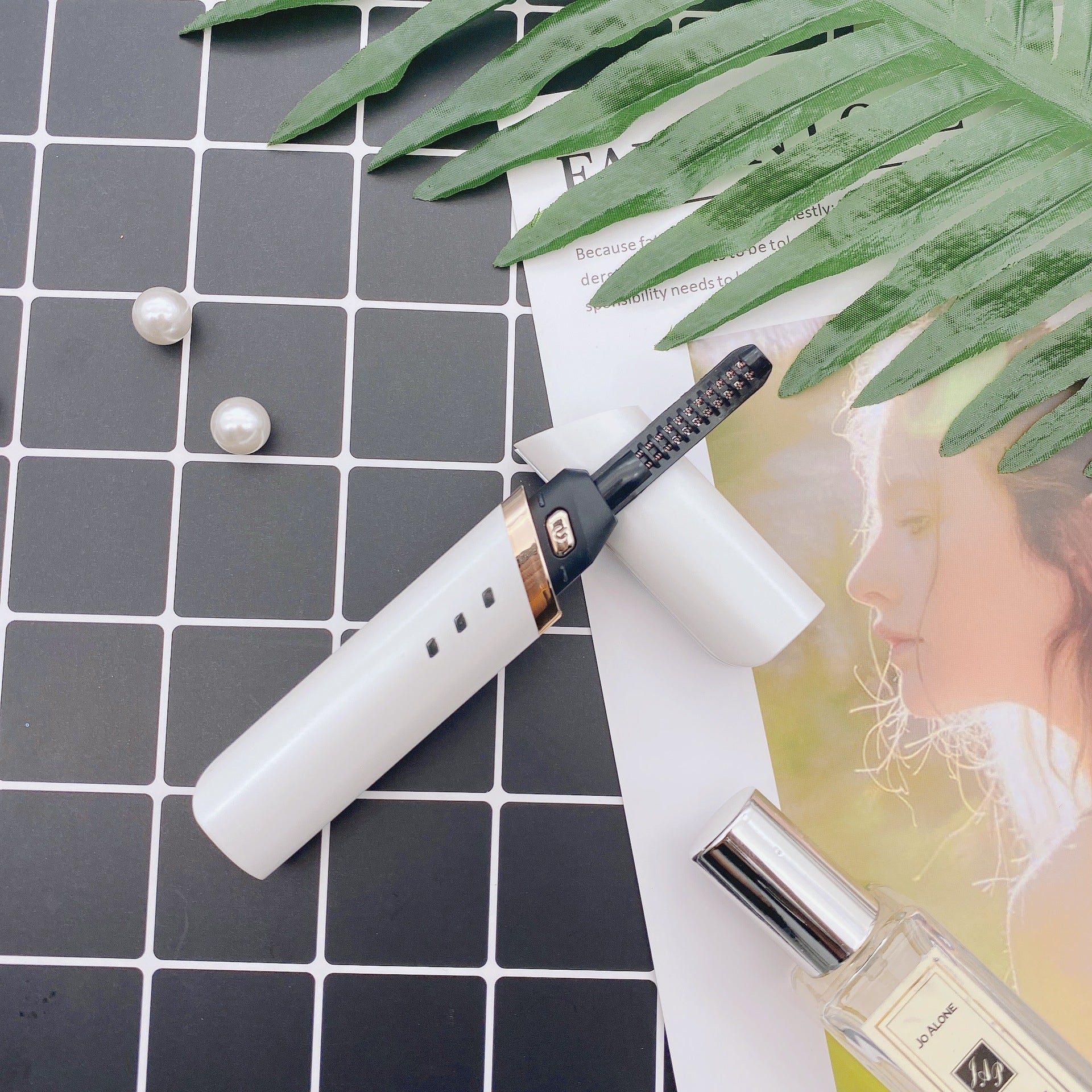 Lumivie Heated Eyelash Curler in white color variant